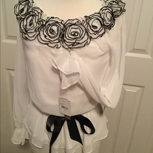 New w/tag White/black blouse w/stretchy neckline.